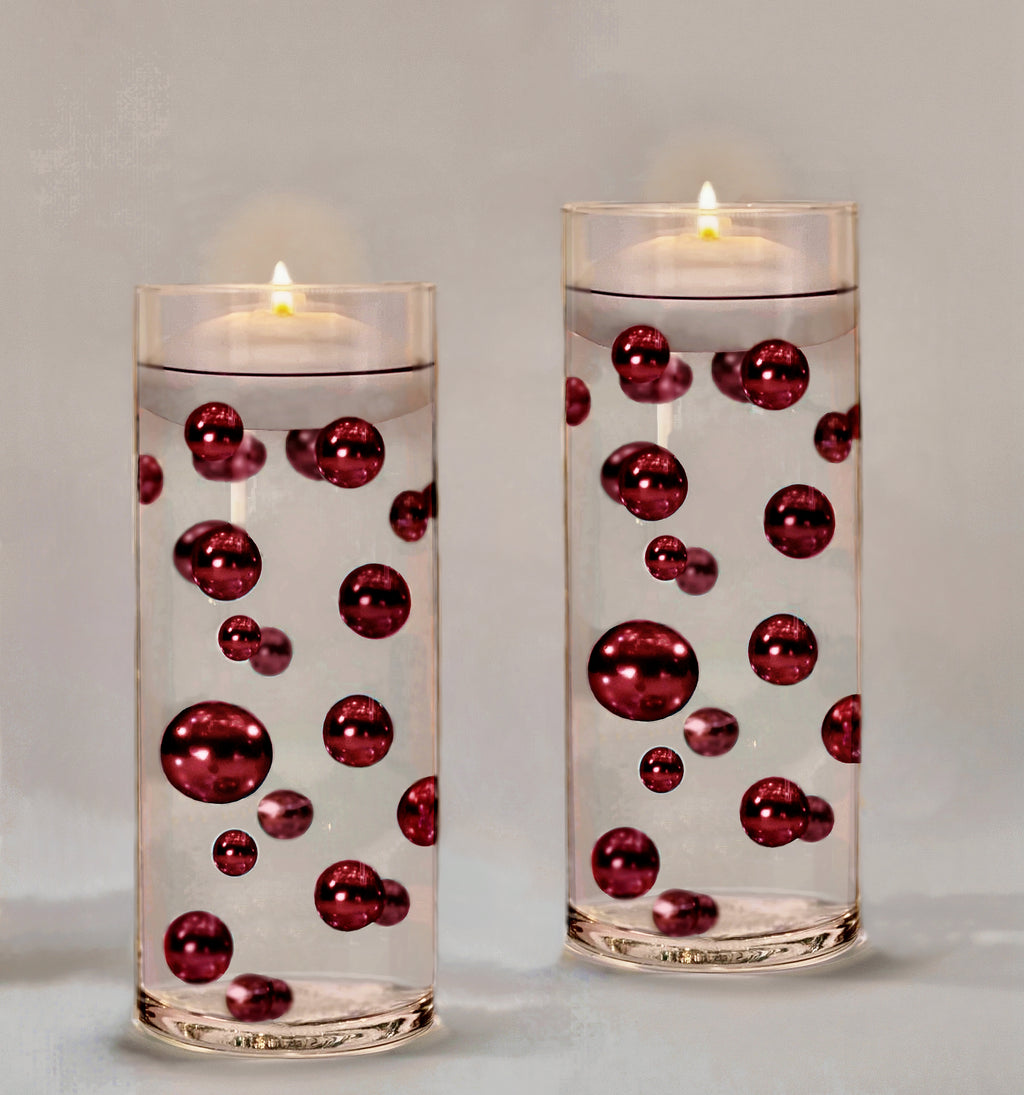 Three cylinder vases with clear water beads and white, ivory and a touch of  pink pearls purchased at vasePea…