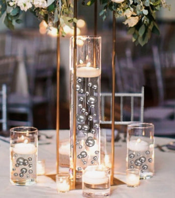 clear gel beads make colored glass beads appear suspended in wate…   Floating candle centerpieces wedding, Candle wedding centerpieces, Floating  candle centerpieces
